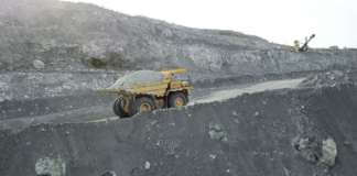 Industry Expert Dr. Larry Neufville to Facilitate Critical Training Session with Quarry Personnel Dump truck loaded with chalk moving on a quarry road. Quarry and mining equipment.